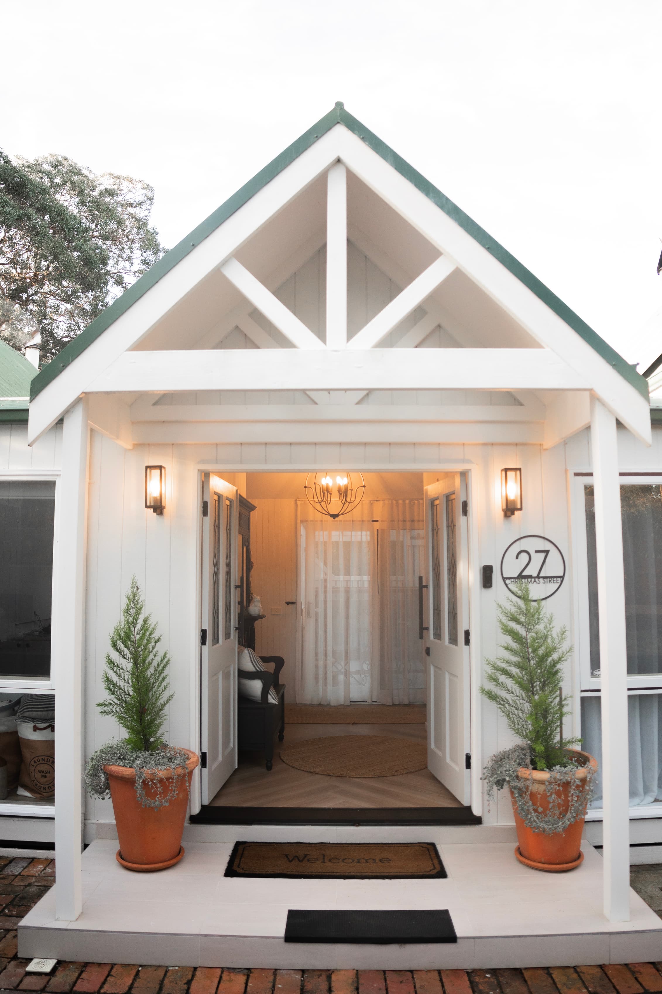 The Main House grand entrance with French doors and waterfront access